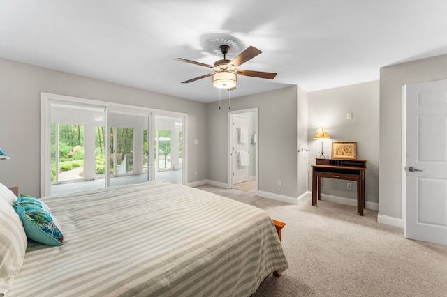 586 Kingscote Dr, Lottsburg, VA 22511 - bedroom featuring baseboards, light colored carpet, ensuite bath, and ceiling fan