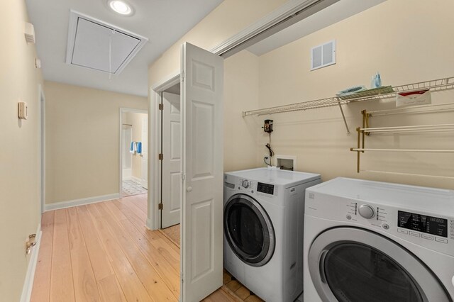 586 Kingscote Dr, Lottsburg, VA 22511 - clothes washing area featuring attic access, washer and clothes dryer, light wood-style floors, baseboards, and recessed lighting