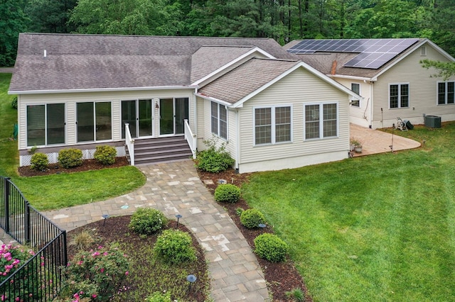 586 Kingscote Dr, Lottsburg, VA 22511 - view of front of home with roof with shingles, a front yard, central AC, and a patio area