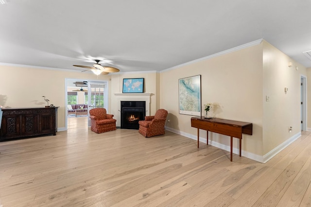 586 Kingscote Dr, Lottsburg, VA 22511 - living area featuring ceiling fan, a warm lit fireplace, hardwood / wood-style floors, baseboards, and ornamental molding
