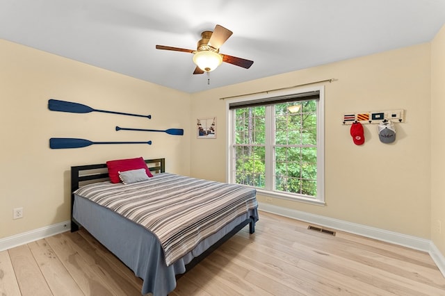 586 Kingscote Dr, Lottsburg, VA 22511 - bedroom featuring baseboards, light wood finished floors, and ceiling fan