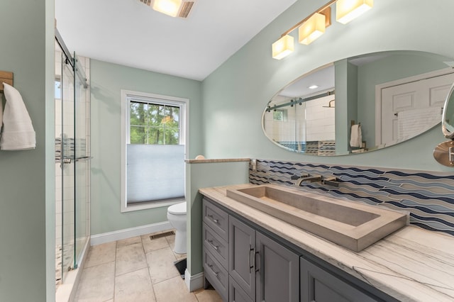 586 Kingscote Dr, Lottsburg, VA 22511 - full bath featuring a stall shower, toilet, vanity, baseboards, and tile patterned flooring