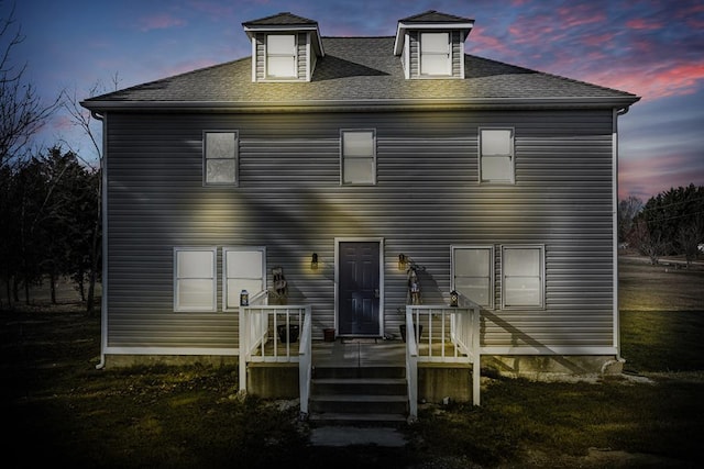 view of front of house with a lawn