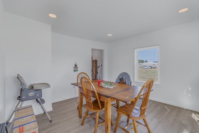 dining area with light hardwood / wood-style flooring