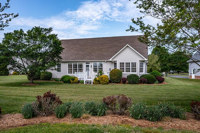 48 Old Field Rd, Irvington, VA 22480 - cape cod-style house with a shingled roof and a front yard