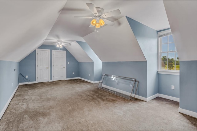 bonus room with baseboards, carpet flooring, ceiling fan, and vaulted ceiling