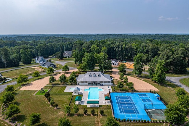 drone / aerial view with a view of trees