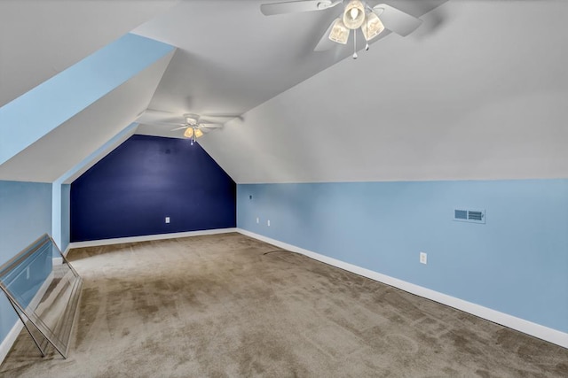 bonus room featuring visible vents, baseboards, ceiling fan, carpet, and vaulted ceiling