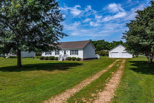 view of front of house featuring a front lawn, a garage, and an outdoor structure