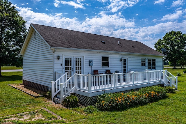 4058 Irvington Rd, Irvington, VA 22480 - back of property with a lawn, a deck, and french doors