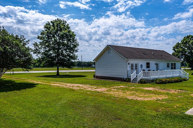 4058 Irvington Rd, Irvington, VA 22480 - rear view of house with a deck and a lawn