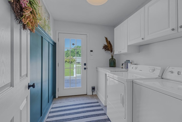 4058 Irvington Rd, Irvington, VA 22480 - laundry room featuring cabinets, light tile patterned floors, and separate washer and dryer