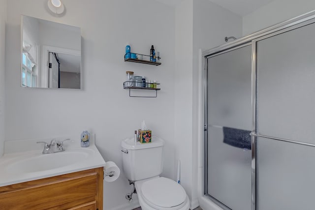 4058 Irvington Rd, Irvington, VA 22480 - bathroom featuring a shower with shower door, vanity, and toilet