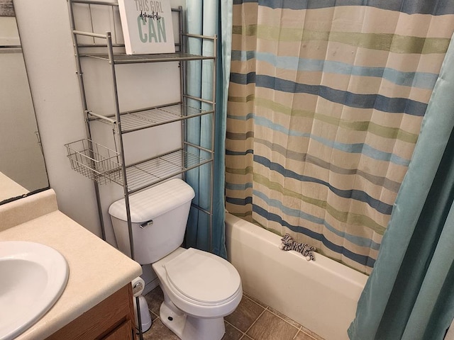 full bath with vanity, toilet, shower / tub combo, and tile patterned flooring