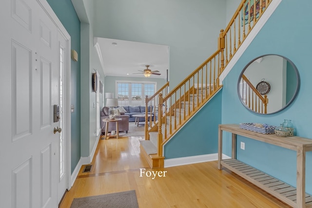 entrance foyer with hardwood / wood-style floors and ceiling fan