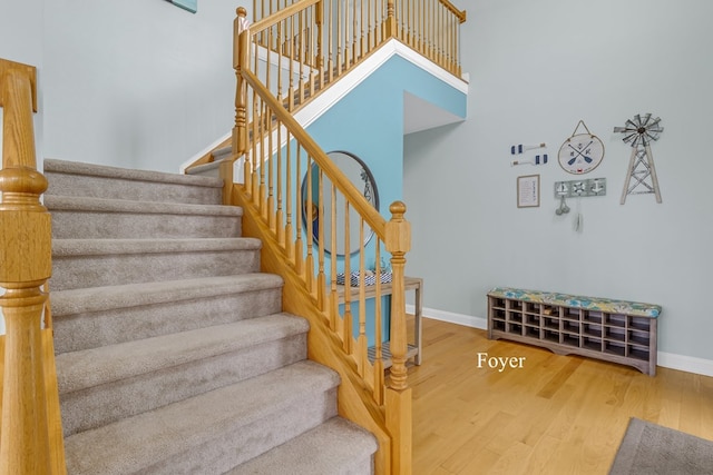 staircase featuring wood-type flooring