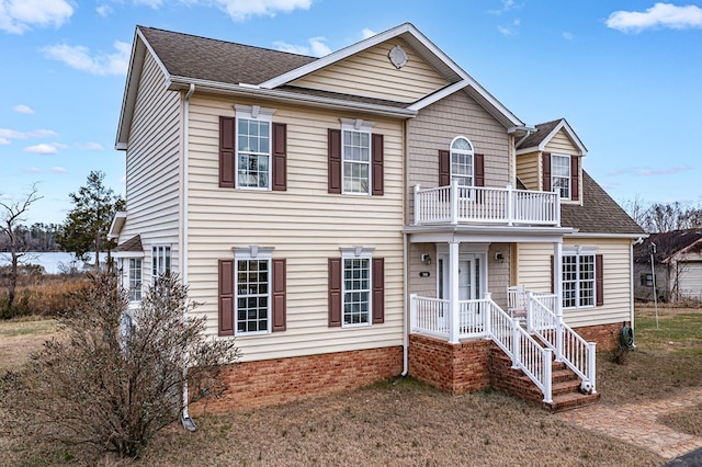 view of front of home with a balcony