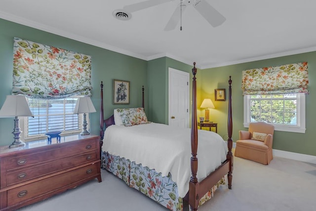 carpeted bedroom with ceiling fan and crown molding