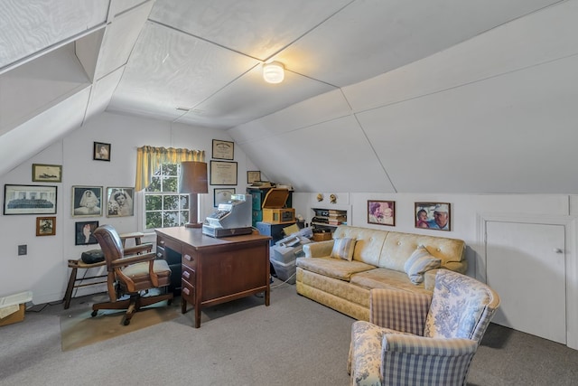 carpeted office space featuring vaulted ceiling