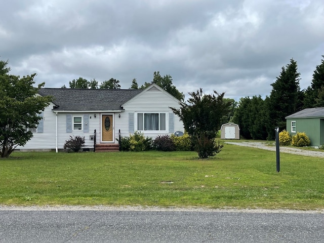 421 Totuskey Church Rd, Warsaw, VA 22572 - ranch-style house with roof with shingles, a front yard, and driveway