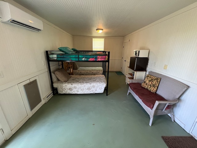 bedroom featuring a wall mounted air conditioner, concrete flooring, and a baseboard radiator