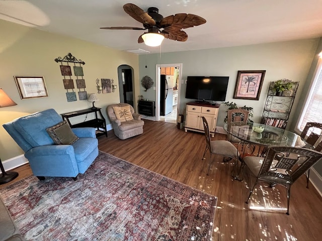 living room with hardwood / wood-style flooring and ceiling fan