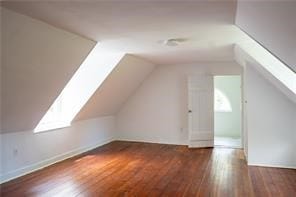 525 Main St, Mathews, VA 23109 - additional living space featuring baseboards, wood finished floors, and vaulted ceiling with skylight