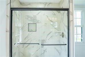 525 Main St, Mathews, VA 23109 - interior space with plenty of natural light and a marble finish shower