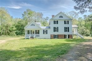 525 Main St, Mathews, VA 23109 - view of front of home with covered porch, stairway, and a front yard