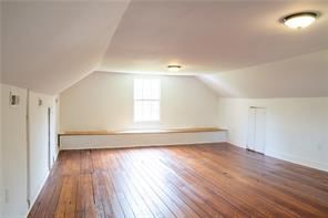 525 Main St, Mathews, VA 23109 - bonus room with dark wood-type flooring, baseboards, and vaulted ceiling
