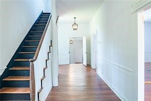 525 Main St, Mathews, VA 23109 - staircase with wood finished floors