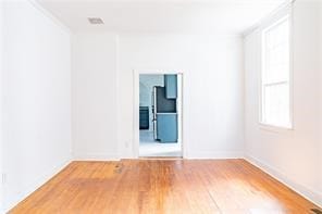 525 Main St, Mathews, VA 23109 - empty room with baseboards and wood finished floors