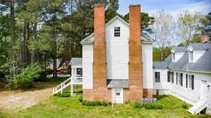 525 Main St, Mathews, VA 23109 - back of property with a lawn and a chimney