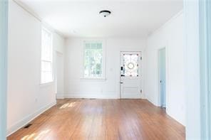 525 Main St, Mathews, VA 23109 - entryway featuring light wood-type flooring, baseboards, and a wealth of natural light