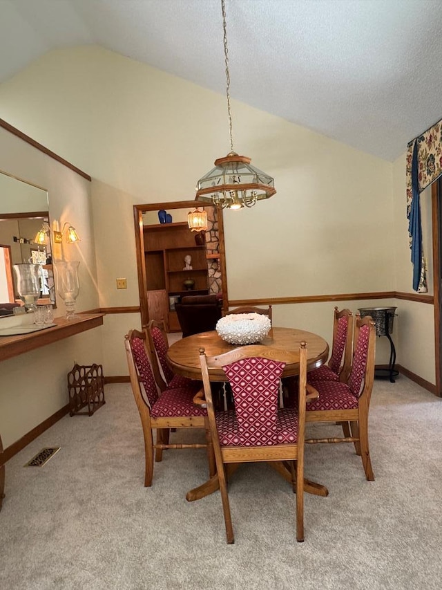 10114 New Hope Ct, Gloucester, VA 23061 - dining room with lofted ceiling, light carpet, and a chandelier