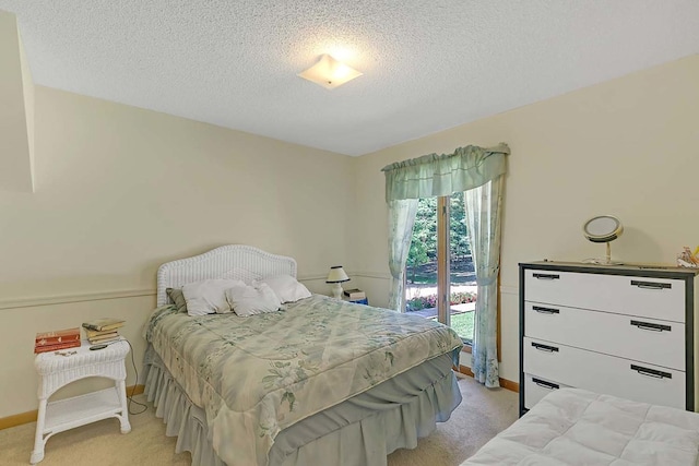 10114 New Hope Ct, Gloucester, VA 23061 - bedroom featuring light colored carpet, access to exterior, and a textured ceiling