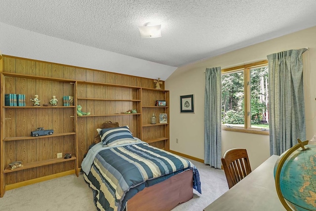 10114 New Hope Ct, Gloucester, VA 23061 - bedroom with lofted ceiling, light carpet, a textured ceiling, and wood walls