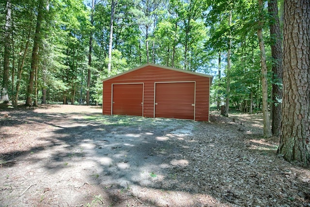 10114 New Hope Ct, Gloucester, VA 23061 - view of outdoor structure featuring a forest view