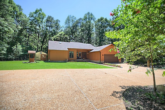 10114 New Hope Ct, Gloucester, VA 23061 - rear view of property featuring an attached garage, a lawn, and concrete driveway