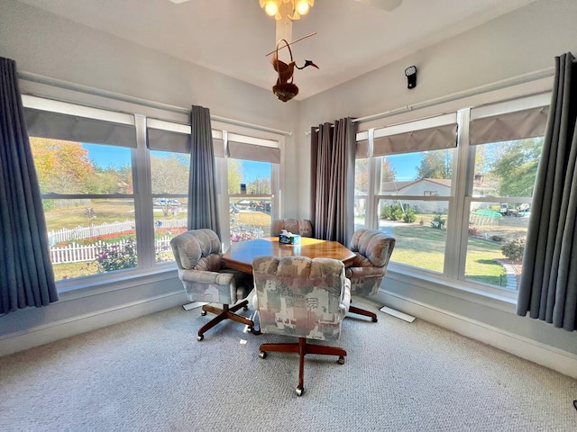 view of carpeted dining area