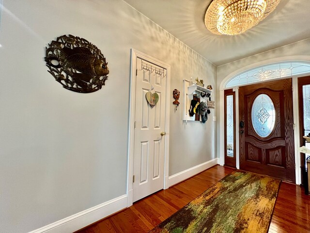 kitchen featuring white cabinetry, a center island, ceiling fan, white appliances, and a breakfast bar