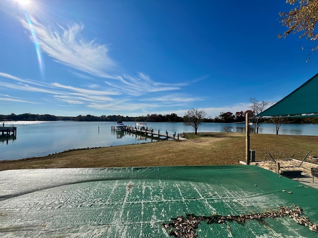 view of dock featuring a yard and a water view