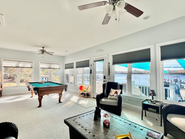 game room featuring ceiling fan, a water view, carpet floors, and pool table