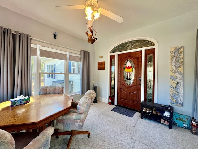 interior space featuring carpet flooring and ceiling fan