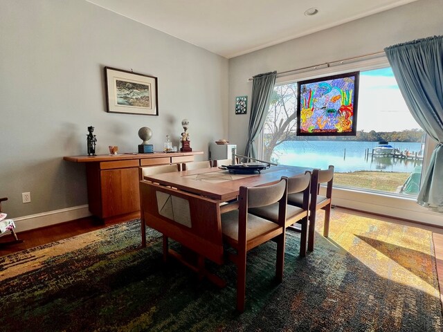 dining area with dark hardwood / wood-style floors