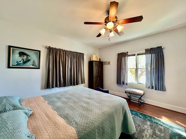 bedroom featuring ceiling fan and hardwood / wood-style floors