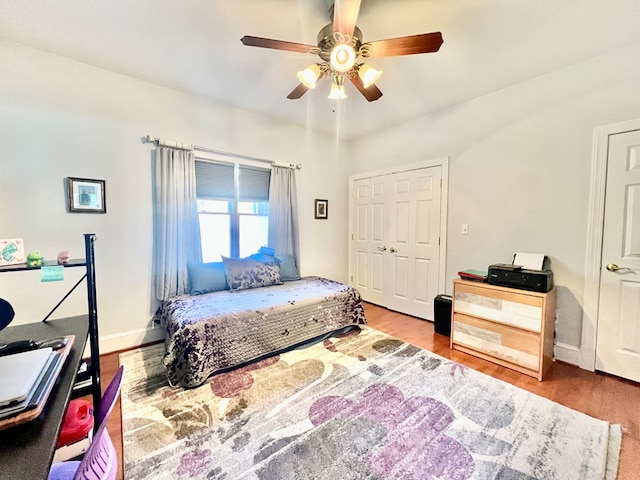 bedroom with a closet, ceiling fan, and hardwood / wood-style floors