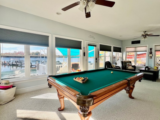 game room featuring carpet flooring, ceiling fan, a water view, and pool table