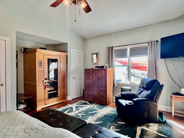 bedroom with hardwood / wood-style floors, ceiling fan, and vaulted ceiling