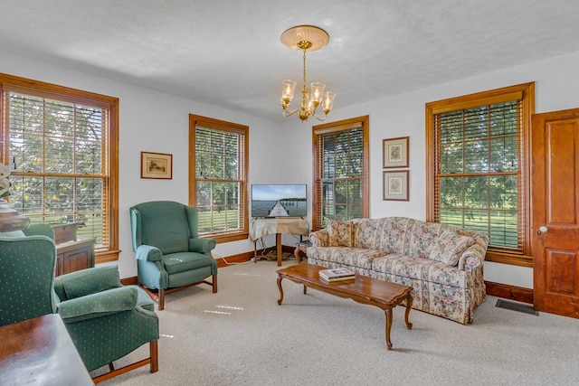 118 Harvey Ln, Heathsville, VA 22473 - living room featuring a chandelier, healthy amount of natural light, and carpet flooring